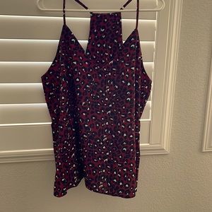 Women’s adjustable strap maroon top. Made of polyester and spandex.